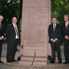 American winners of the 2010 Nobel Prize pose next to their names, recently inscribed on the city's Nobel Monument